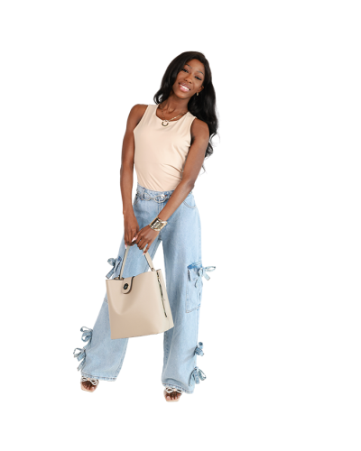 The women's junior model wears the beige 