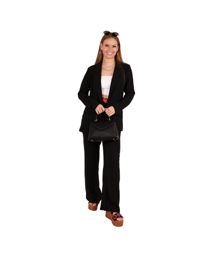 The female contemporary model wears the black "No Comment" Air Flow Blazer, white "Bozzolo" Seamless Tube Top, black "No Comment" High Waisted Air Flow Pants, and the black "Forever" 3 1/2" Women Flower Platform Sandals.
