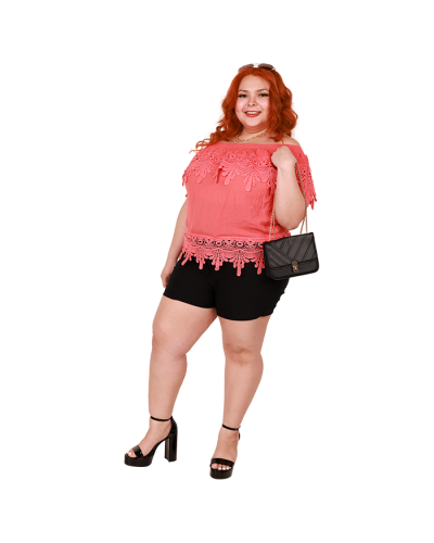 The women's plus size model wears the coral 