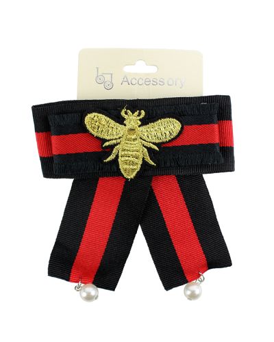 The "Be Jewel" Insect Embroidered Striped Bow is pictured here.