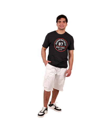 The male model wears the black "Aero" Short Sleeve Aeropostale 87 Graphic Tee, white "Raw X" Cargo Pocket Belted Shorts, and the black and white "Forever" Low Top Pleather Lace-up Sneakers.