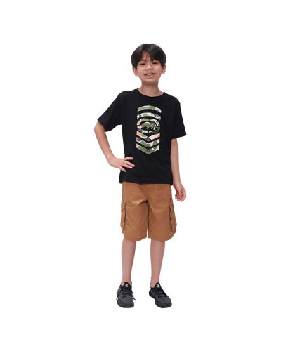 Pictured is a boy wearing our"Ecko" Short Sleeve Camo Filled Rhino Logo Tee with tan cargo shorts and black athletic shoes.