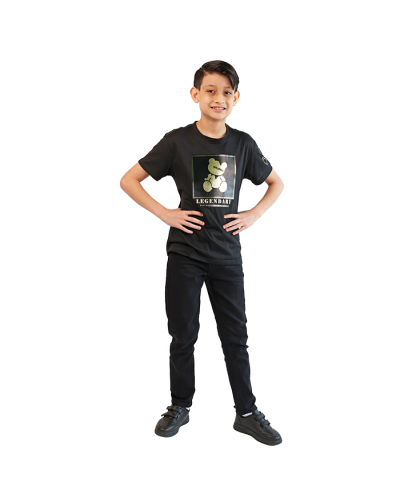 The boy model wears the "CR-24" Short Sleeve Black Legendary Teddy Bear Tee, "True Indigo" Black Denim Jeans, and the black "Air" 2" Velcro Athletic Shoes.
