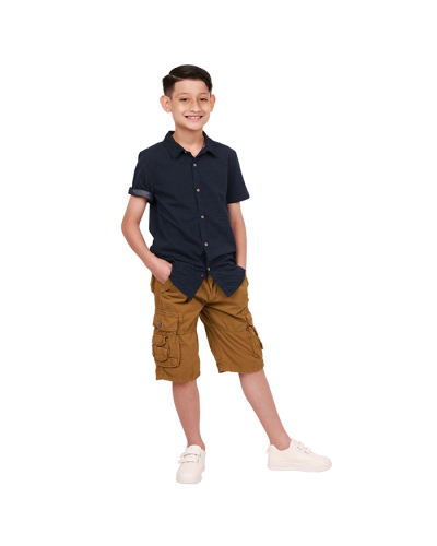 The boy model wears the "Cactus" Short-Sleeve Navy White Polka Dot Dress Shirt, "Raw" Twill Cargo Pocket Shorts and topped off with the sporty "Air" 2-Velcro athletic sneakers.