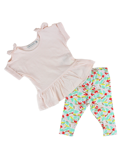 Pictured is the cream ruffle shoulder tie top and leafy floral multicolored leggings that are part of the 