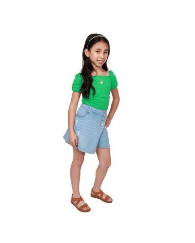 The girl model wears our kelly green "Papermoon" Short Sleeve Square Neck Ruched Top and "Starride" Light Wash Denim Triple Button Asymmetrical Skirt with tan "Lucky" Comfort Elastic X-Strap Flat Sandals.