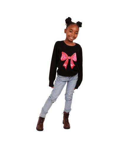 The girl model wears the "Davida" Black Pink Rhinestone Bow Graphic Sweater, "Gogo" Light Wash Rhinestone Front Denim Skinny Jeans, and the "Lucky" 2" Lug Sole Pleather Lace-Up Combat Boots.