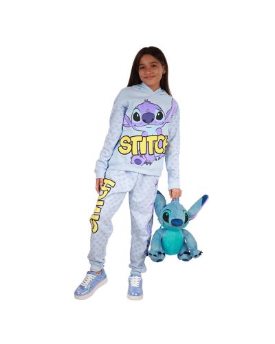 The girl model wears our "Freeze" Stitch Fleece Hoodie, Pants Set, and blue "Link" Pleather Holographic Athletic Sneakers.