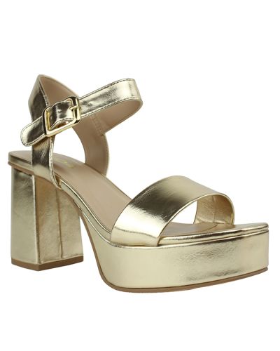 The metallic gold "Soda" 3 1/2" Patent Pleather Platform Heels are pictured here.