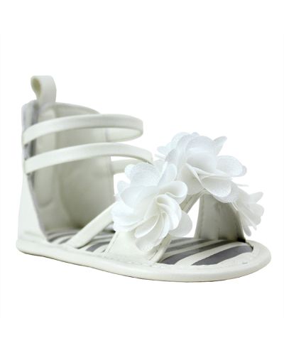 The "First" White Strappy Velcro Back Flat Floral Sandals are pictured here.