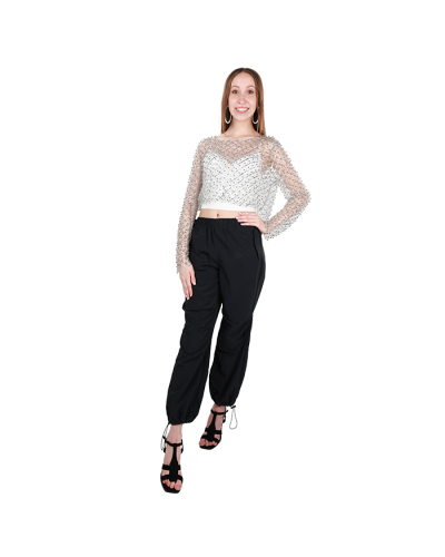 The female junior model wears our silver "Love J" Jeweled Mesh Long Sleeve Top layered over our white "Superline" 16" Ribbed Bra Cup Basic Crop Tank with our black "Ikeddi" 11" Parachute Pants and our black "Forever" 4" Cage Open Toe Heeled Dress Sandals.