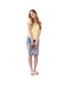 Woman wearing yellow babydoll blouse, blue cuffed short jeans and yellow sandals