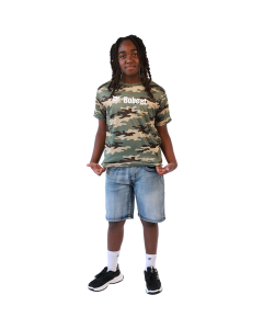 Boy wearing green camo, light wash denim shorts and black and white shoes
