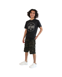 The male model wears the black "Aero" Short Sleeve Circle Logo Tee, "Raw X"  Cargo Pocket Twill Shorts, and the white "Forever" Low Top Lace Tie Court Athletic Shoes.