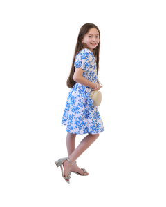 Girl wearing puffy sleeve royal blue dress and silver glitter heels