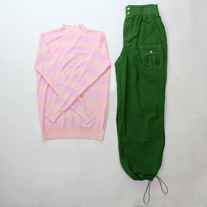 Melrose styling an outfit with our light pink and a green inspired by Pantone 16-5938 TCX Mint 