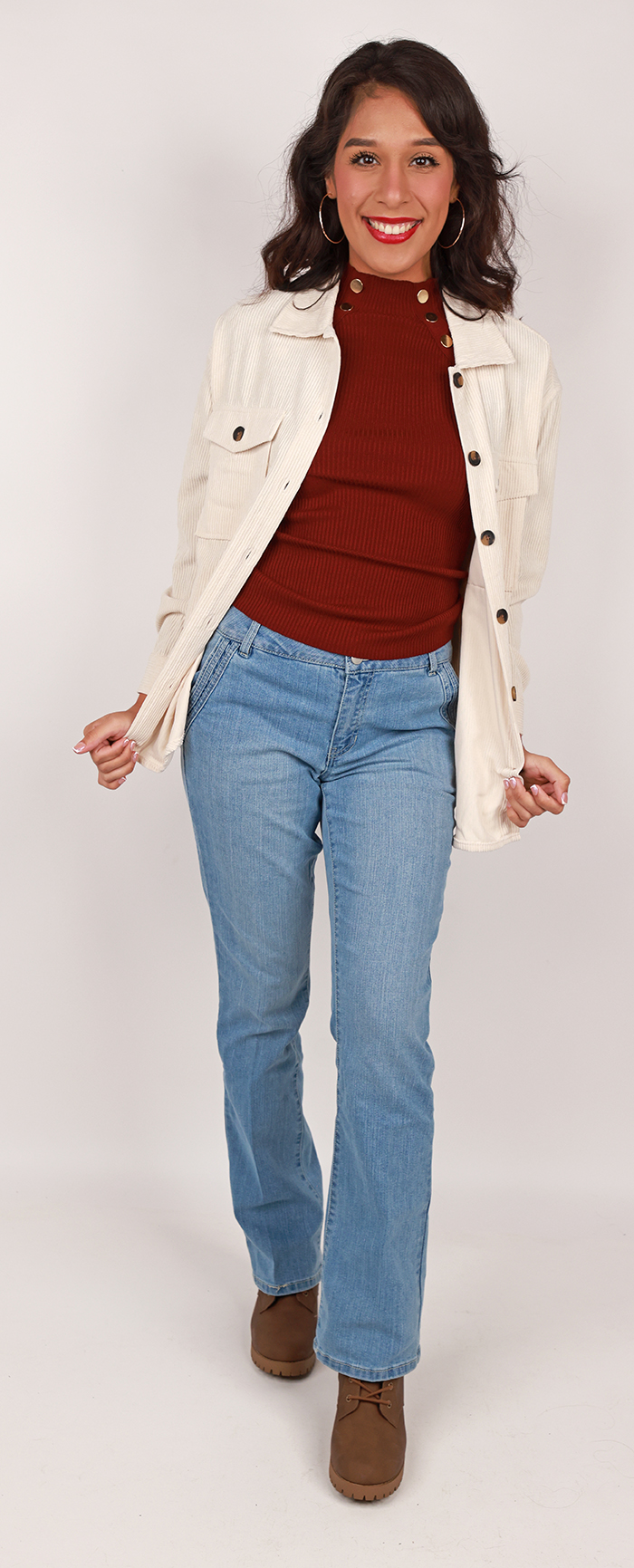 The female contempoary model wears the "No Comment" Long Sleeve Corduroy Button Down Shirt, "Full Circle" 23" Long Sleeve Gold Button Sweater, "DJEANS" Light Wash Straight Leg Denim Jeans and the "Soda" 2 1/2" Stack Lace-up Heeled Booties.