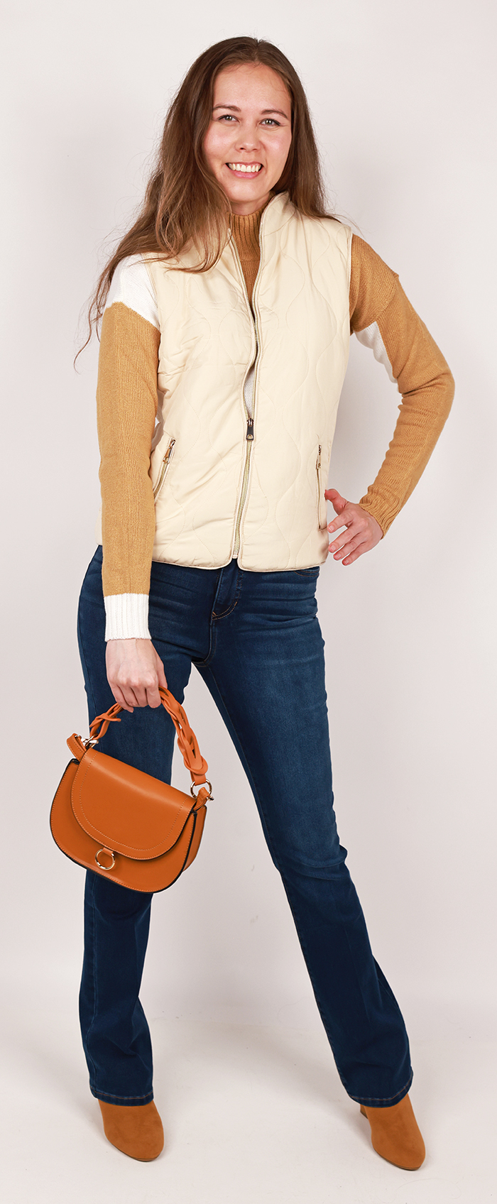 Cute, cozy and fashionable all at once, you set the standard with our "BHJ" Sleeveless Quilted Vest Jacket, "Full Circle" Long Sleeve Mock Neck Color Block Sweater, "DJEANS" Straight Leg Denim Jeans, and "Forever" 3" Wedge Heel Booties.
