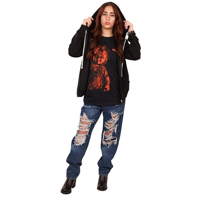 Embrace the spirit of Halloween all year round with the chilling "Freeze" Red Chucky Graphic Tee. This eye-catching shirt features a vibrant design that captures the iconic character in a fun yet spooky way. Pair it effortlessly with your favorite pleather or denim pieces for a stylish look perfect for any occasion, whether hanging out with friends or making a statement at a themed event. It's a must-have for any horror fan looking to fashionably showcase their love for the genre.