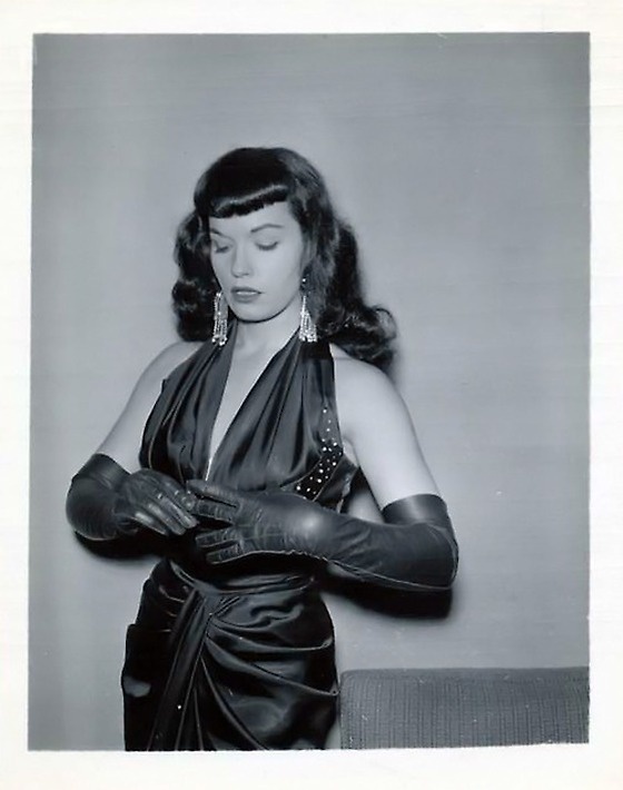 A Bettie Page vintage 1950s pin up photo is pictured here.