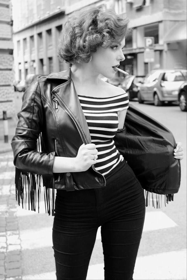 An example of 1950s women's greaser fashion is pictured here.