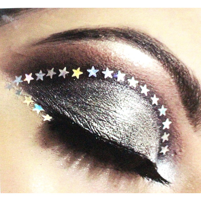 Silver and black eyeeshadow with stars from the "UP" Multicolor/Clear Rhinestone Face Jewels.