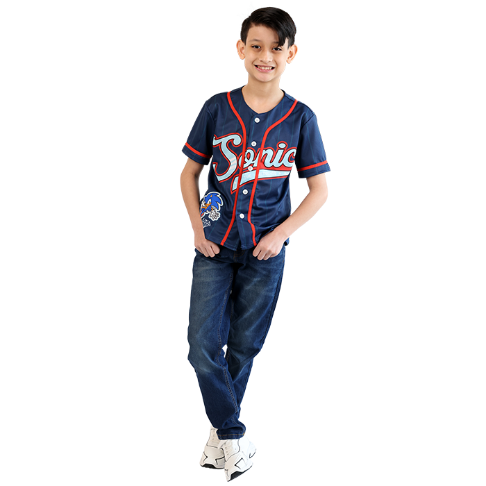 Your little boy is a fan of Sonic the Hedgehog, and he can express his enthusiasm with a stylish and comfortable outfit that reflects his love for the fastest hedgehog around. Start with the eye-catching "Sonic" Short Sleeve Button Down Baseball Tee, made from soft, breathable fabric that ensures all-day comfort for active play. Featuring vibrant graphics of Sonic in action, this tee is perfect for any young fan looking to stand out. Pair the tee with the "True Indigo" Dark Wash Denim Jeans, crafted from quality, durable denim. These jeans offer a classic fit with just the right amount of stretch, providing freedom of movement for your little one. The timeless dark wash is versatile and can be easily dressed up or down, making it an essential piece for any boy's wardrobe. To complete the look, the "Air" Pleather Lace-Tie and Velcro Athletic Shoes are an excellent choice. These shoes feature a sleek design with bold color accents, suitable for everyday wear. Made from durable pleather, they are easy to clean and maintain. The combination of lace-tie and Velcro ensures a secure fit, allowing your child to slip them on and off effortlessly—perfect for busy days filled with adventures.