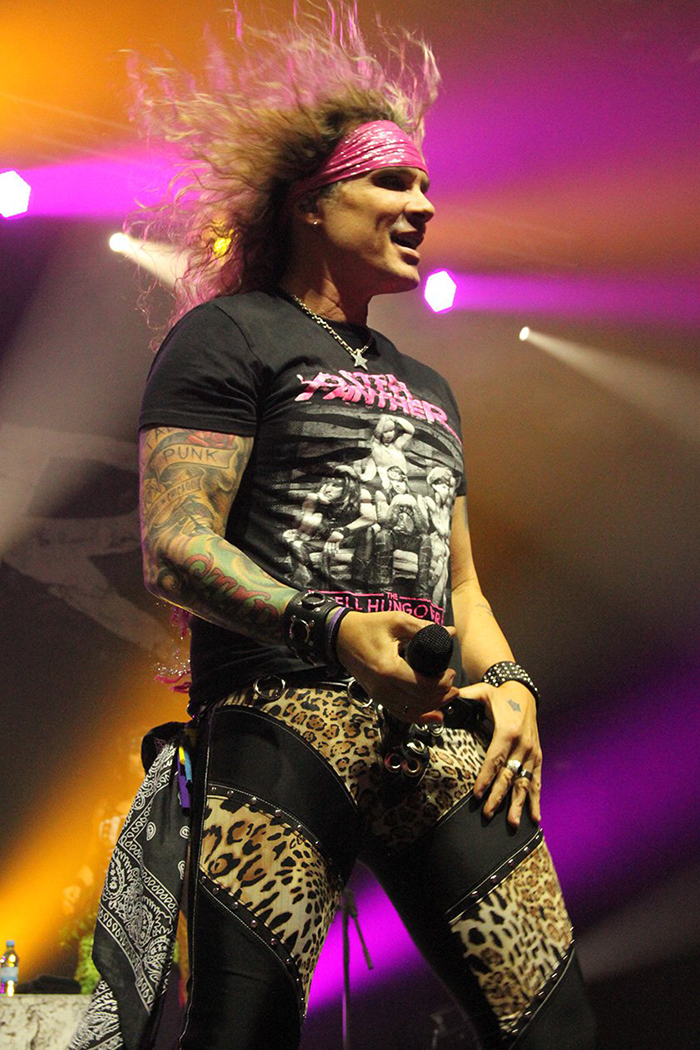 Michael Starr wears leopard print pants.