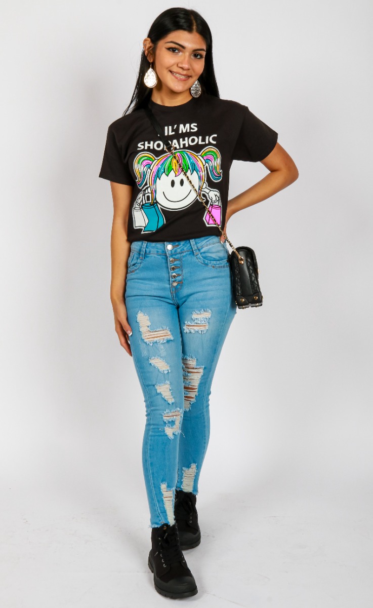 Pictured above is a My Melrose look by Sydney Cooper featuring the "Miss Popular" Short Sleeve Lil' Ms Shopaholic tucked into the "BR" Light 10" 5 Button Distressed Skinny Jeans. To finish she chose the black Women’s Soda Canvas Lug Sole High Top Sneakers