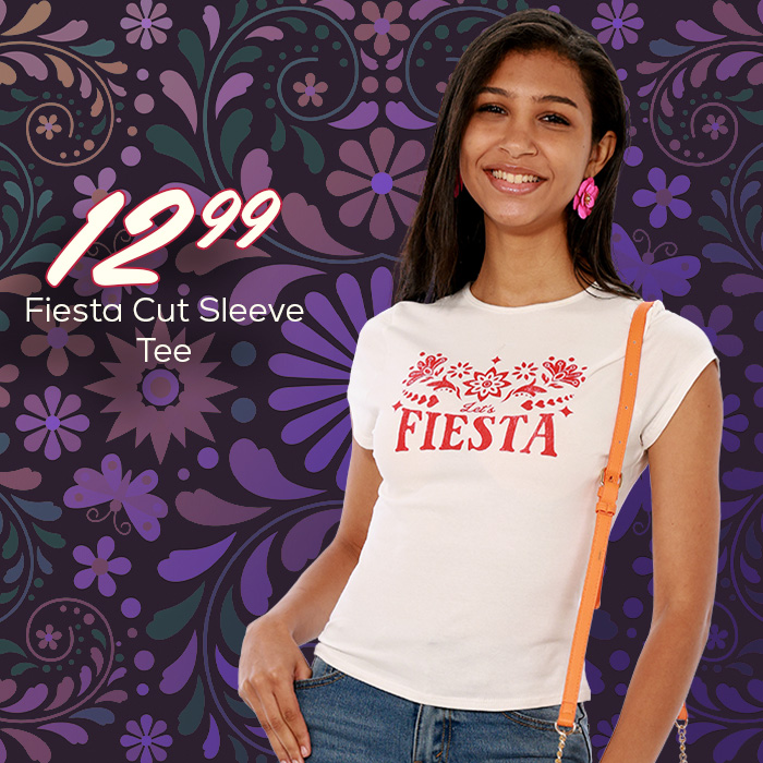 Young woman wearing a white short sleeve shirt with a floral fiesta logo on the chest