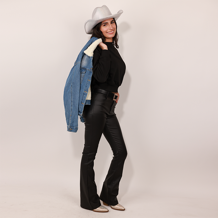 Model showcasing "Rhinestone cowgirl" look featuring pleather pants, rhinestone hat and boots and denim jacket